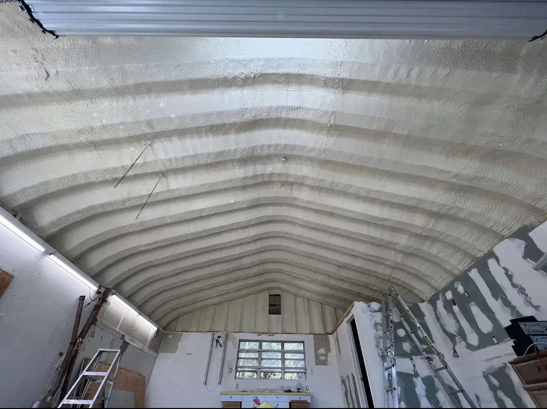 Spray polyurethane foam applied to the underside of a metal roof deck in Vernon