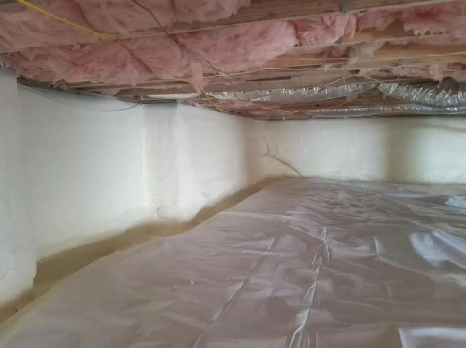 Crawl space encapsulation with closed-cell spray foam for Commercial Roof Restoration in Vernon